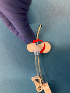 What is Clik-FIX® and how is it used to secure central venous access devices? crossed and folded securement straps